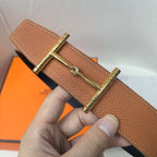 Brown leather belt with gold-tone buckle clasp and stitched leather edge