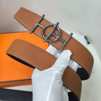 Leather belt with tan/brown strap and silver double D buckle, stitched border