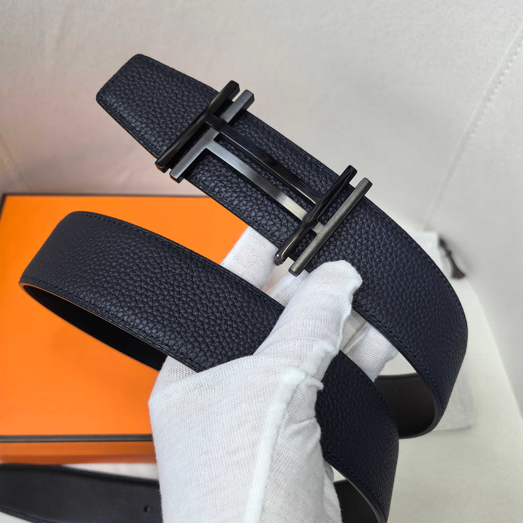 Navy leather belt with silver-tone buckle and keeper