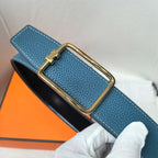 Leather belt, blue textured strap with gold buckle and stitched edges.