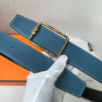 Leather belt, blue textured strap with gold buckle and visible adjustment holes.