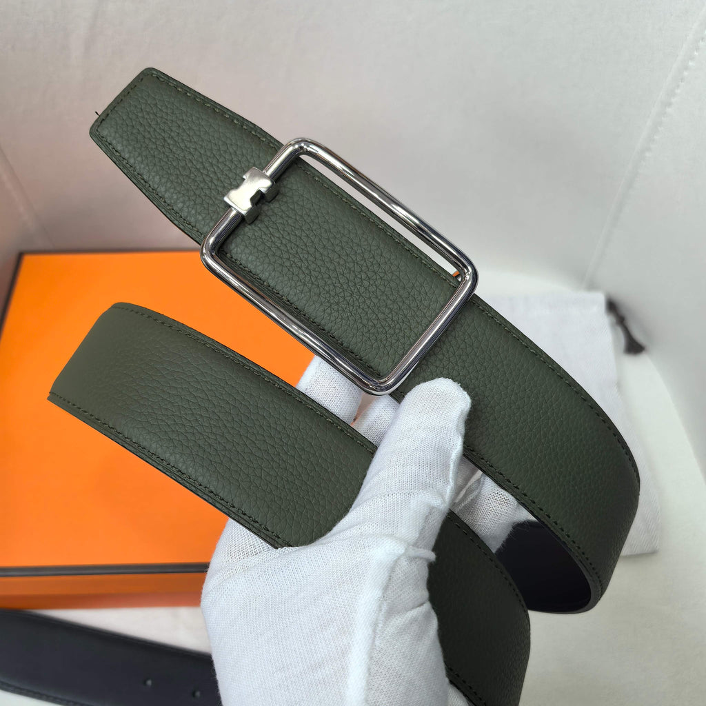 Green leather belt with silver rectangular buckle and loop strap detail