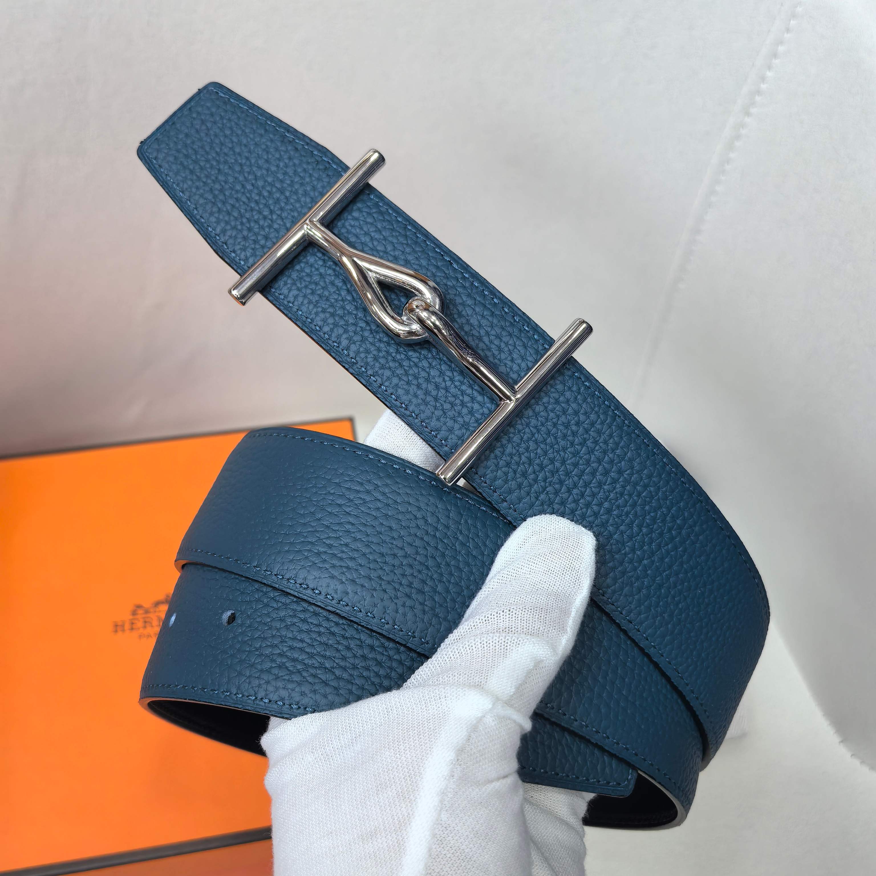 Hermes blue leather belt with silver double-prong buckle and loop detail