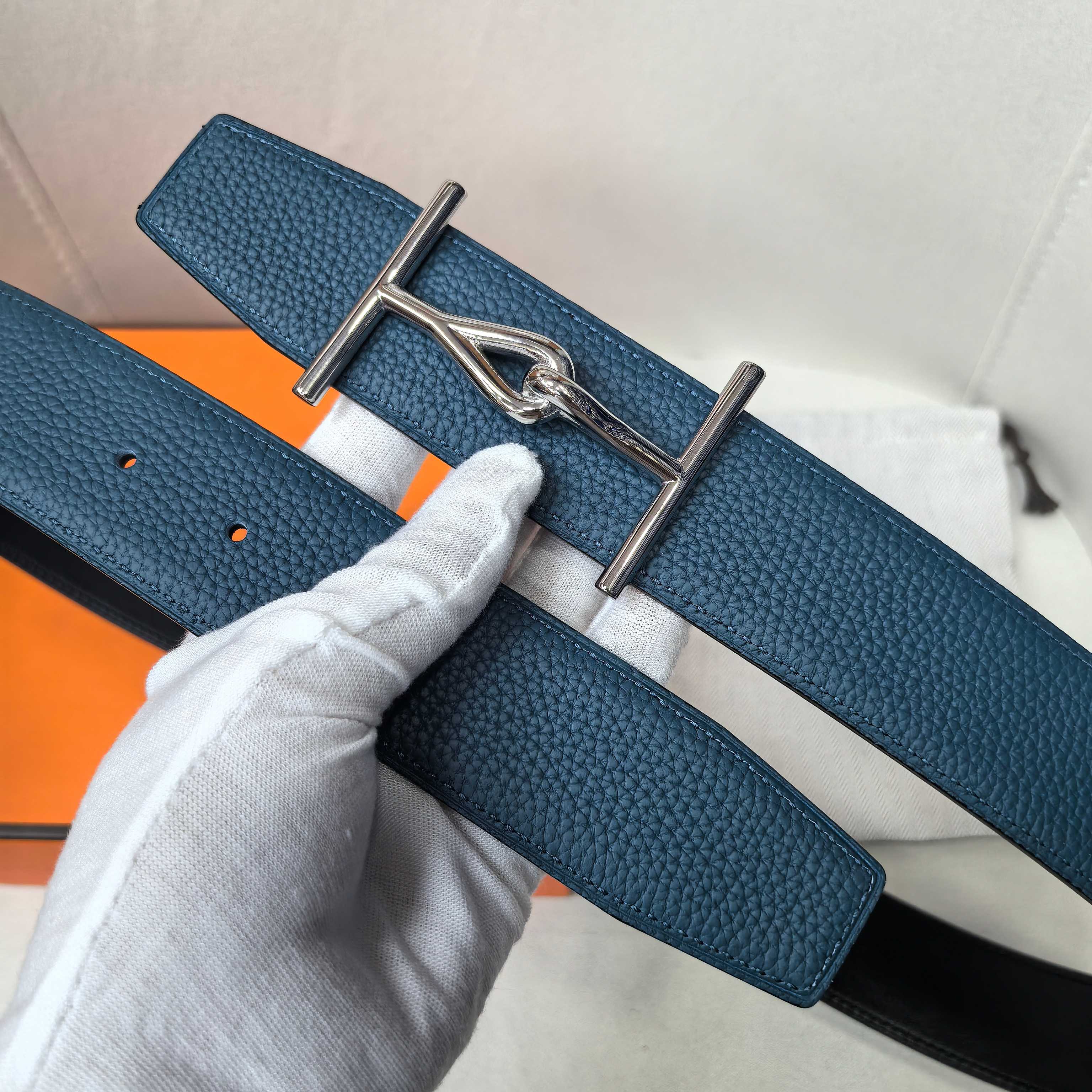Hermes blue leather belt with silver buckle and punched adjustment holes