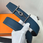 Hermes blue leather belt with silver buckle, strap end and textured grain visible