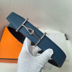Hermes blue leather belt with silver buckle, curved strap end visible