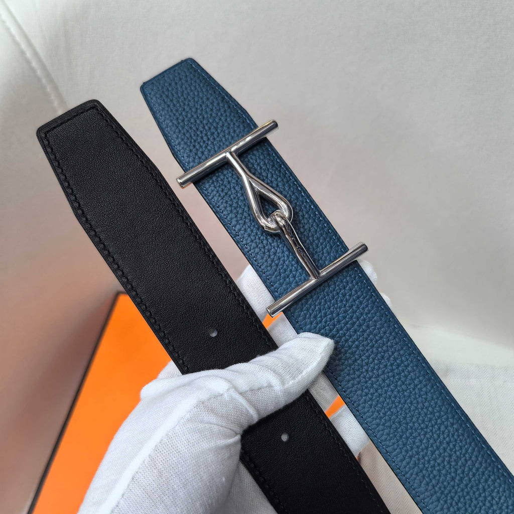 Hermes two-tone leather belt with silver buckle, showing black and blue straps