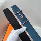 Hermes two-tone leather belt with silver buckle, showing black and blue straps