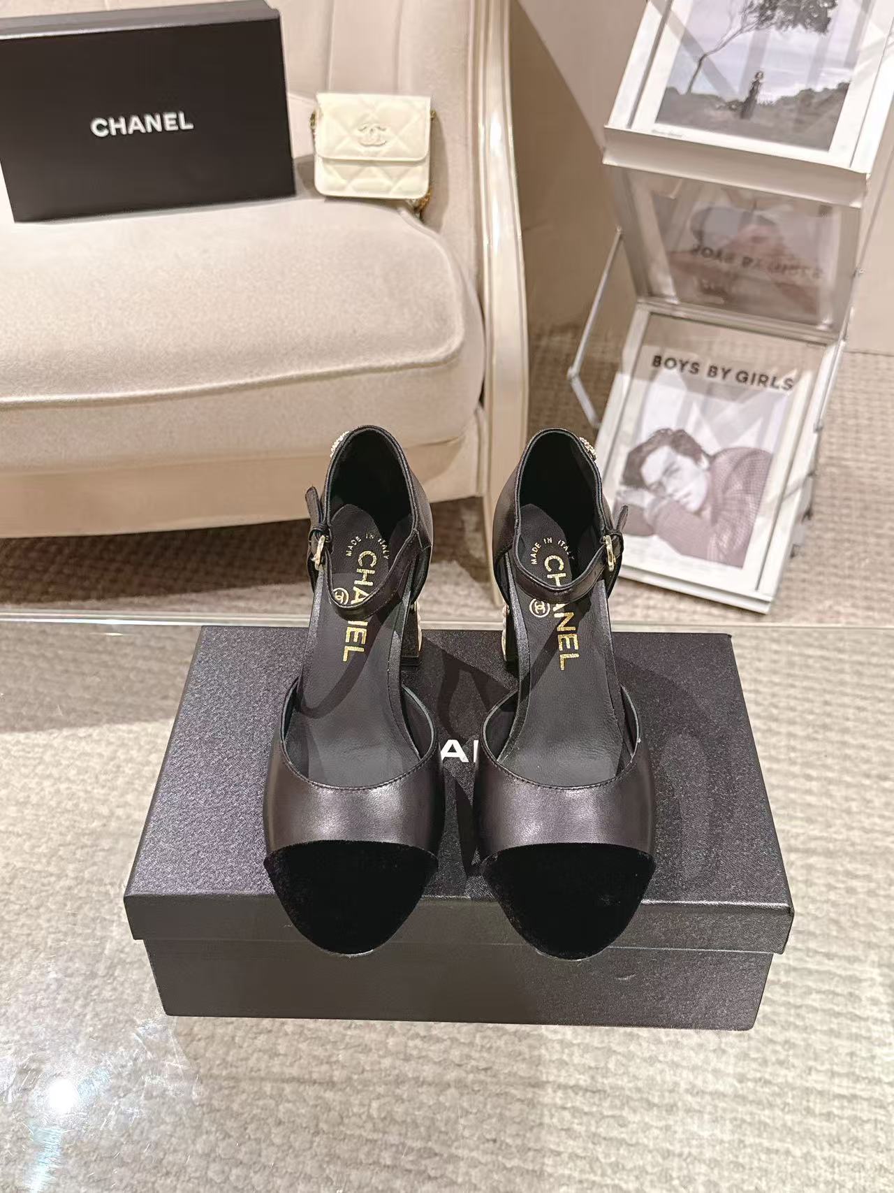 Women's black heeled sandals with ankle strap and chunky embellished heel
