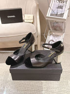Women's black heeled sandals with ankle strap and block heel