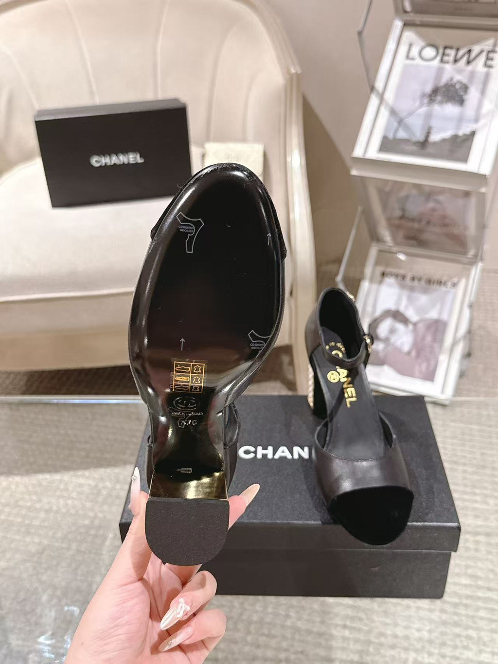 Women's black heeled sandals, view of outsole and heel base