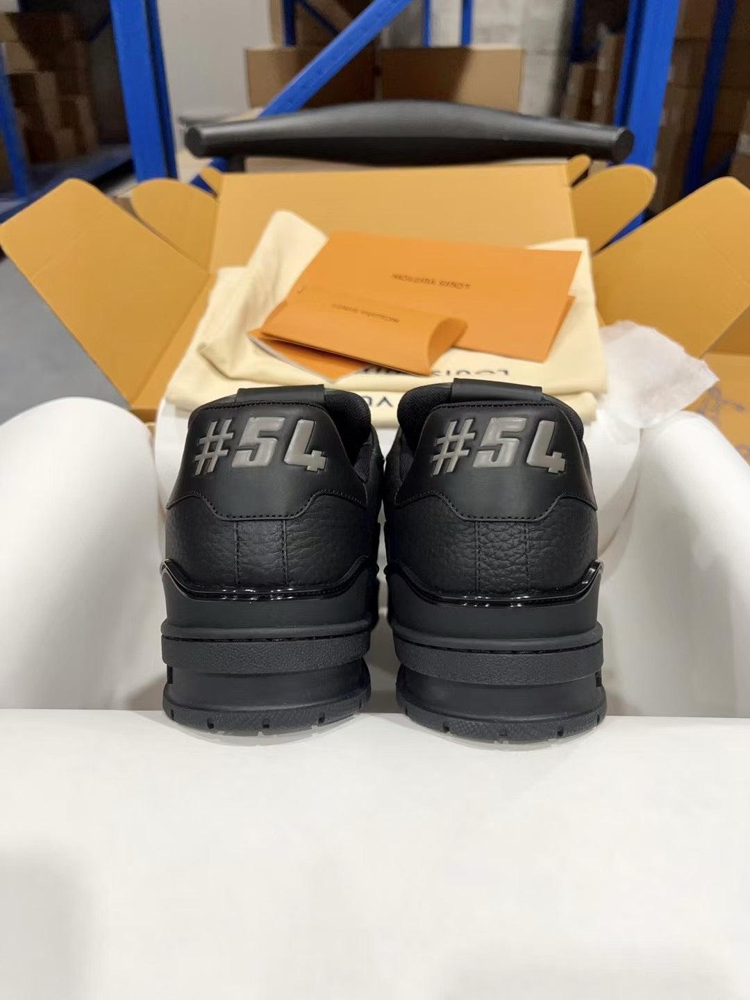 Louis Vuitton black sneakers with #54 emblem on heel