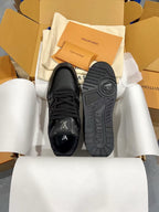 Louis Vuitton black sneakers with LV logo on tongue and treaded sole