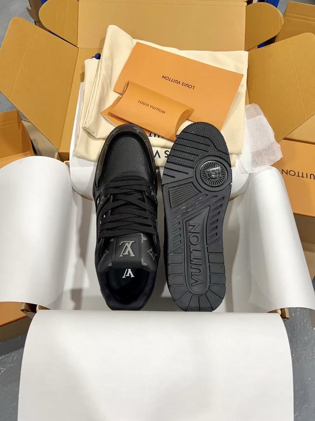 Louis Vuitton black sneakers with LV logo on tongue and treaded sole