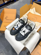 Louis Vuitton low-top sneakers, dark blue-black with white laces and LV monogram on side