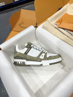 Louis Vuitton trainer shoe, side view, white and olive monogram panel, white lace-up