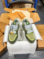 Front view of green and olive Louis Vuitton trainer sneakers with white laces