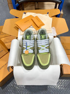 Pair of green and olive Louis Vuitton trainer sneakers in box with white lace details