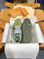 Green and olive Louis Vuitton trainer sneakers showing treaded soles and heel branding
