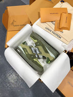 Louis Vuitton trainer sneakers with camo-style green uppers and white laces