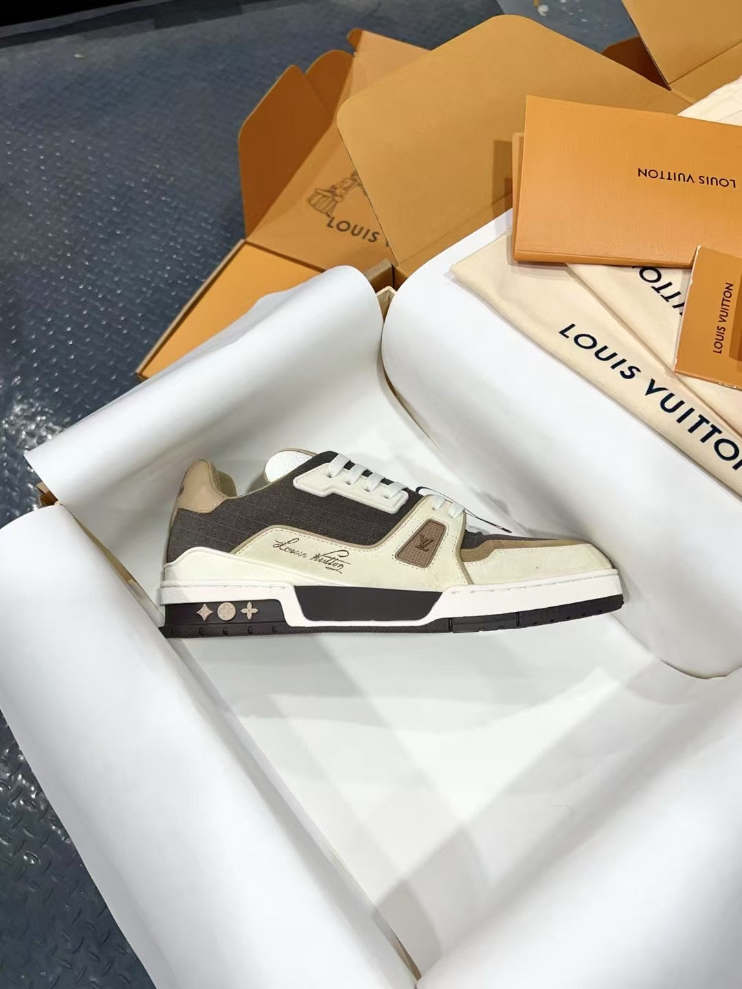 Louis Vuitton trainer sneakers in dark gray and white, low-top profile view