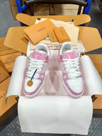 Pink and white low-top sneakers with white laces and stitched logo details