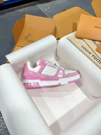 Pink and white low-top sneakers with white laces and pink heel accent