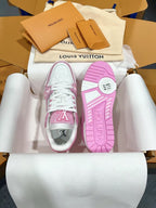 Pink and white sneakers with visible outsole tread and sidewall logo prints