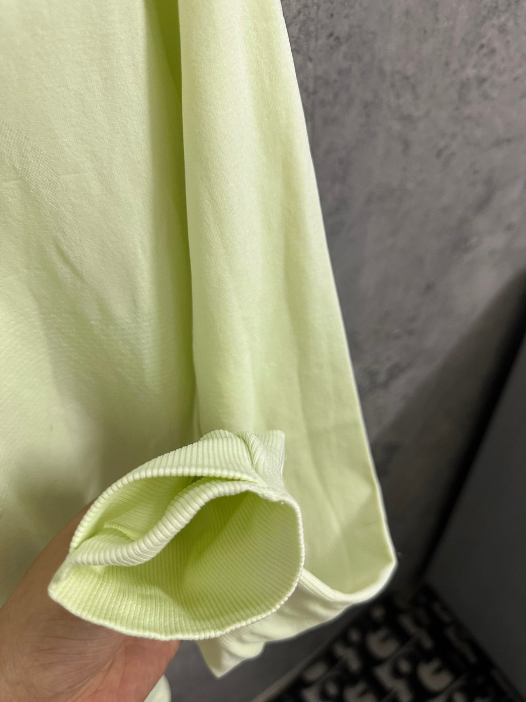 Light lime long-sleeve shirt sleeve cuff with gathered knit hem