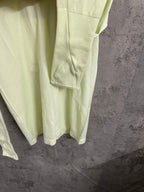 Light lime long-sleeve shirt sleeve cuff and side seam detail