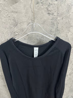 Black crewneck long-sleeve top neckline detail, pullover style