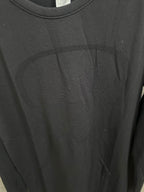 Black long-sleeve top front detail with crew neckline and knit fabric