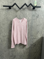 Light pink long-sleeve crewneck top with contrasting neckline trim