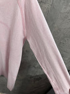 Light pink long-sleeve top with contrast side seam detail
