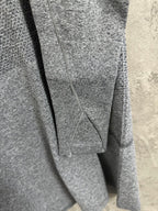 Heather gray long-sleeve knit top close-up of back seam and neckline area