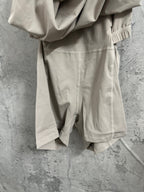 Ralph Lauren sleeveless beige dress close-up, elastic leg cuffs and stitched seams