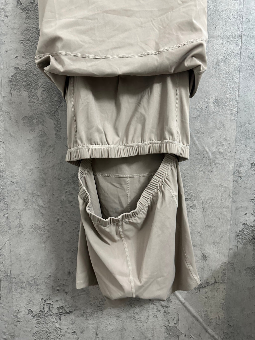 Ralph Lauren sleeveless beige dress back close-up with ribbed hem and gathered waist