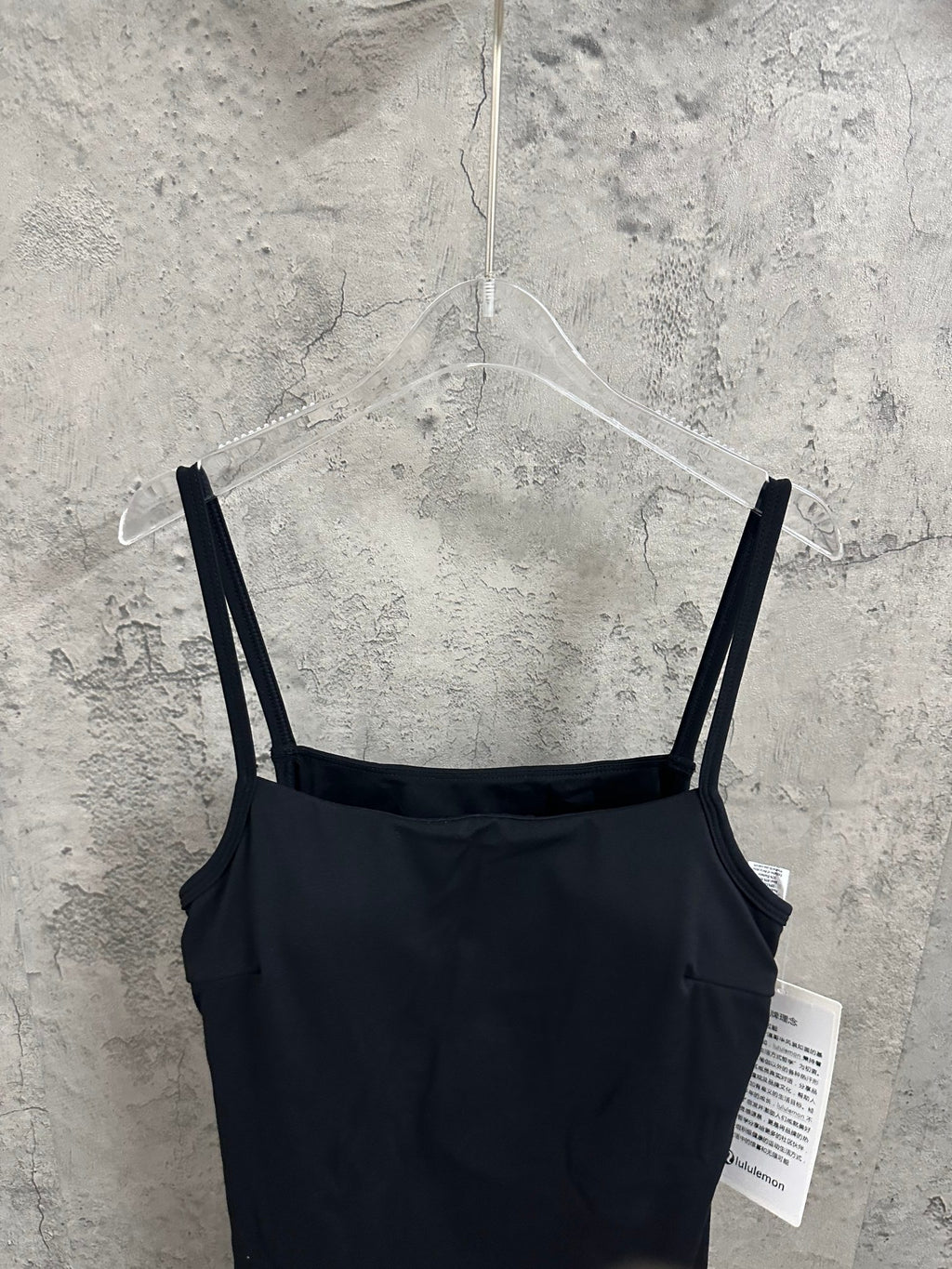Black spaghetti-strap dress with scoop neckline