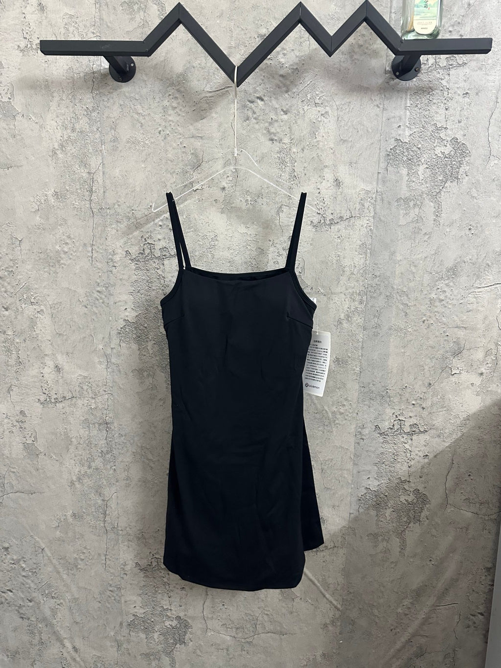 Black spaghetti-strap dress with straight hem