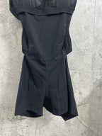 Black fitted dress with skirt that flares at the hem