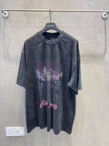 Charcoal graphic T-shirt with skyline print and cursive text on the front