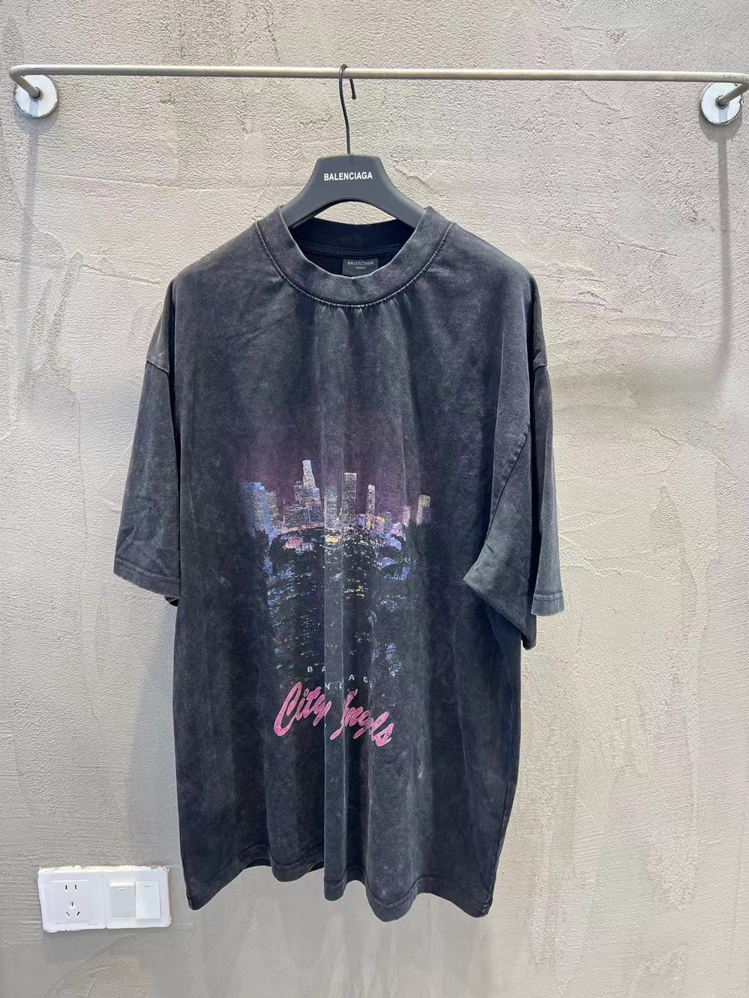 Charcoal graphic T-shirt with skyline print and cursive text on the front