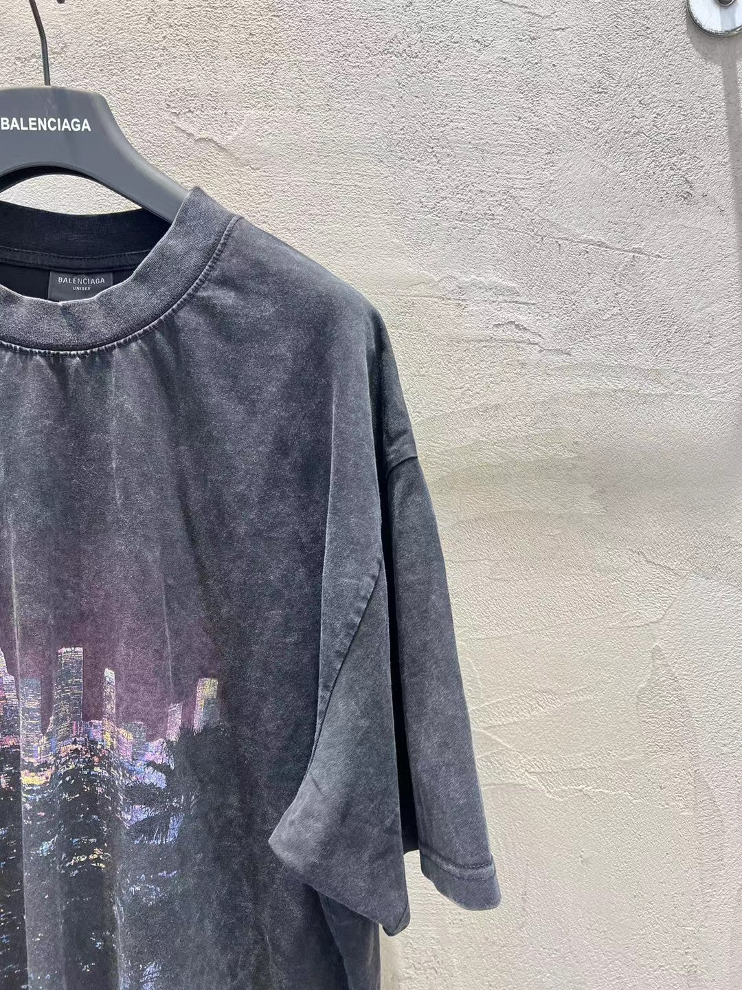 Charcoal graphic T-shirt side view with short sleeves and front print