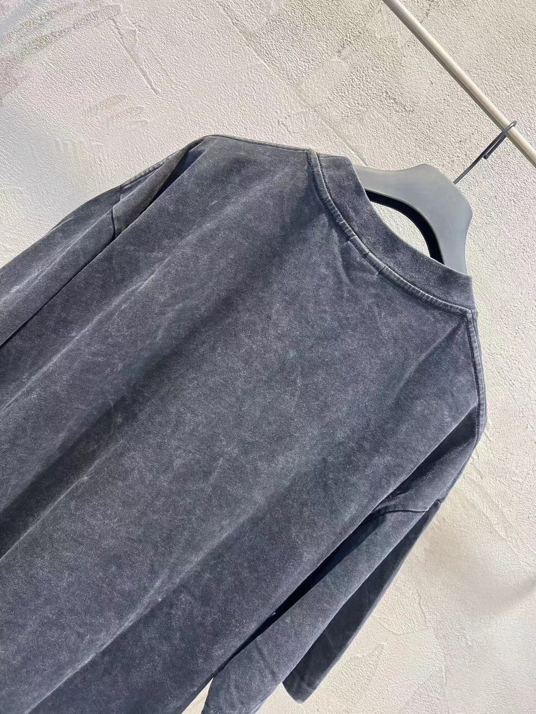 Balenciaga T-shirt, dark charcoal wash, close-up of front panel and shoulder