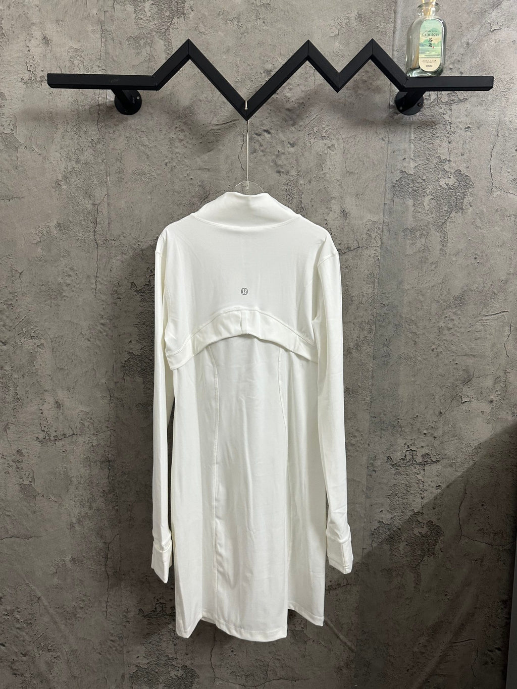White long-sleeve shirt dress with curved yoke seam and stand collar