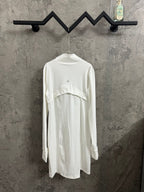 White long-sleeve shirt dress with curved yoke seam and stand collar