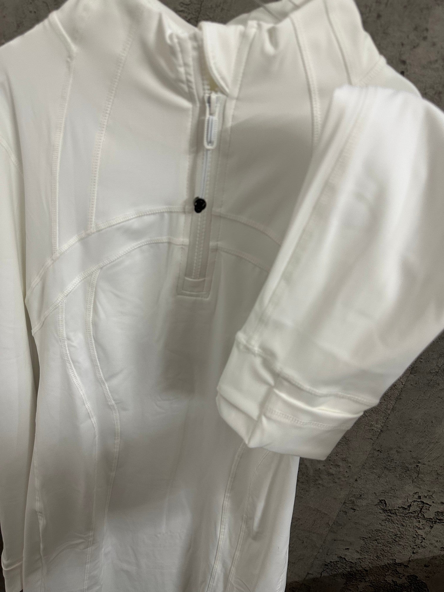 White shirt dress close-up of front placket and curved panel seams