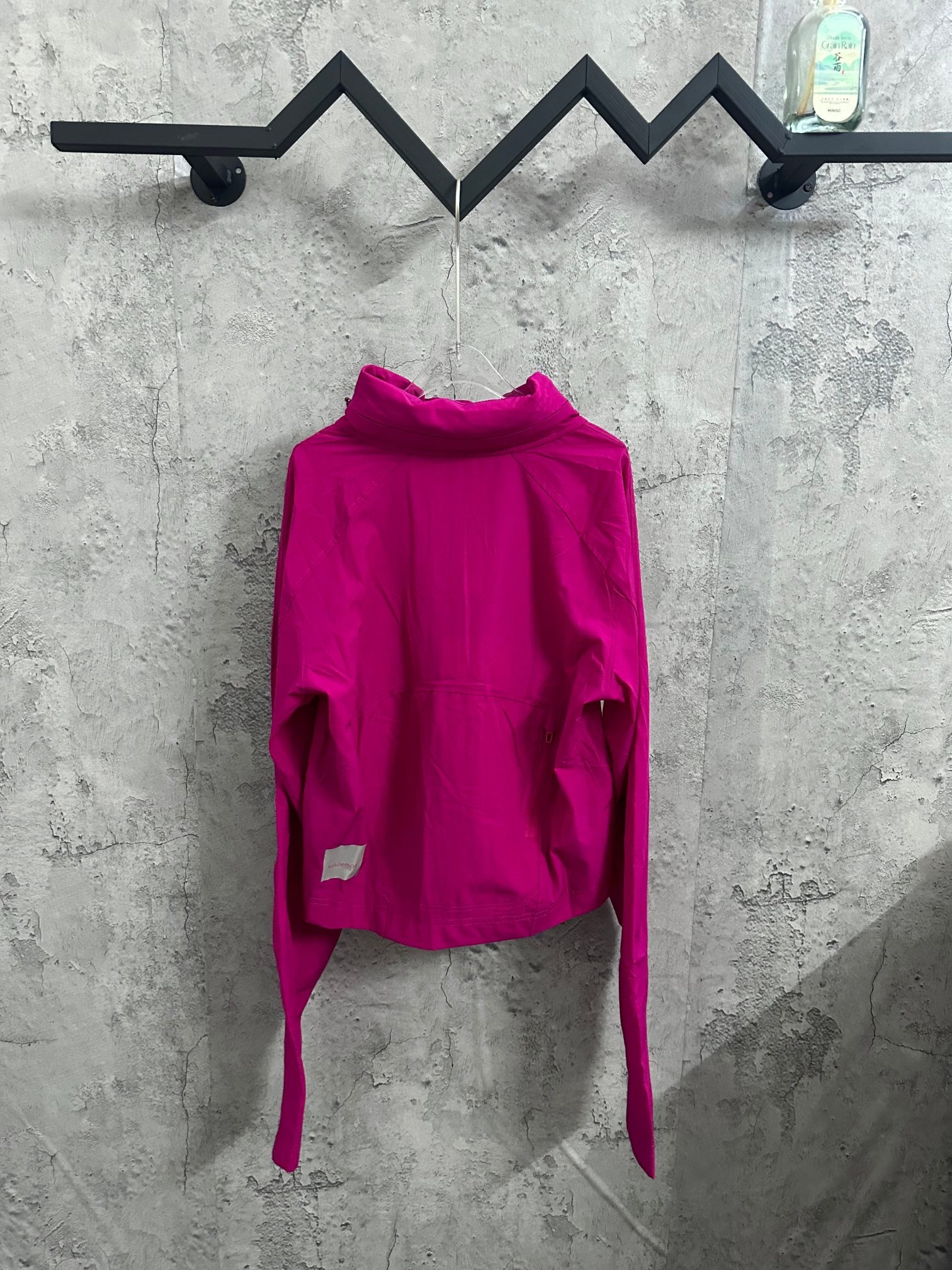 Ralph Lauren clothing: fuchsia hooded jacket, front view, long sleeves, curved hem