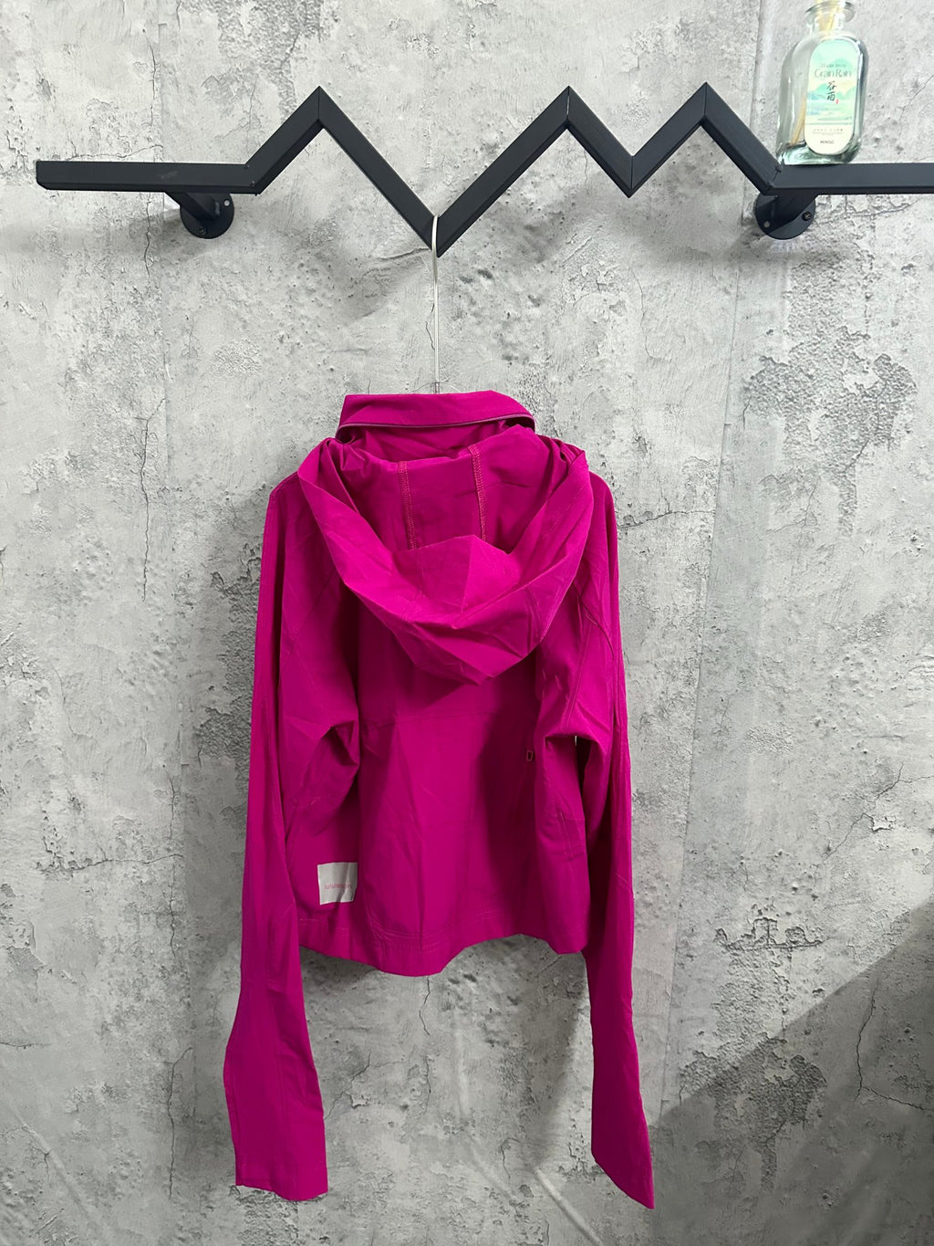 Ralph Lauren clothing: fuchsia hooded jacket back view with adjustable hood ties