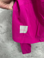 Fuchsia jacket with lululemon logo label on hem